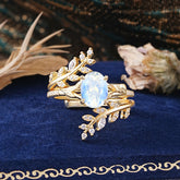 Delicate Leaf Embellished 4 - Prong Oval - Cut Moonstone Ring Sets